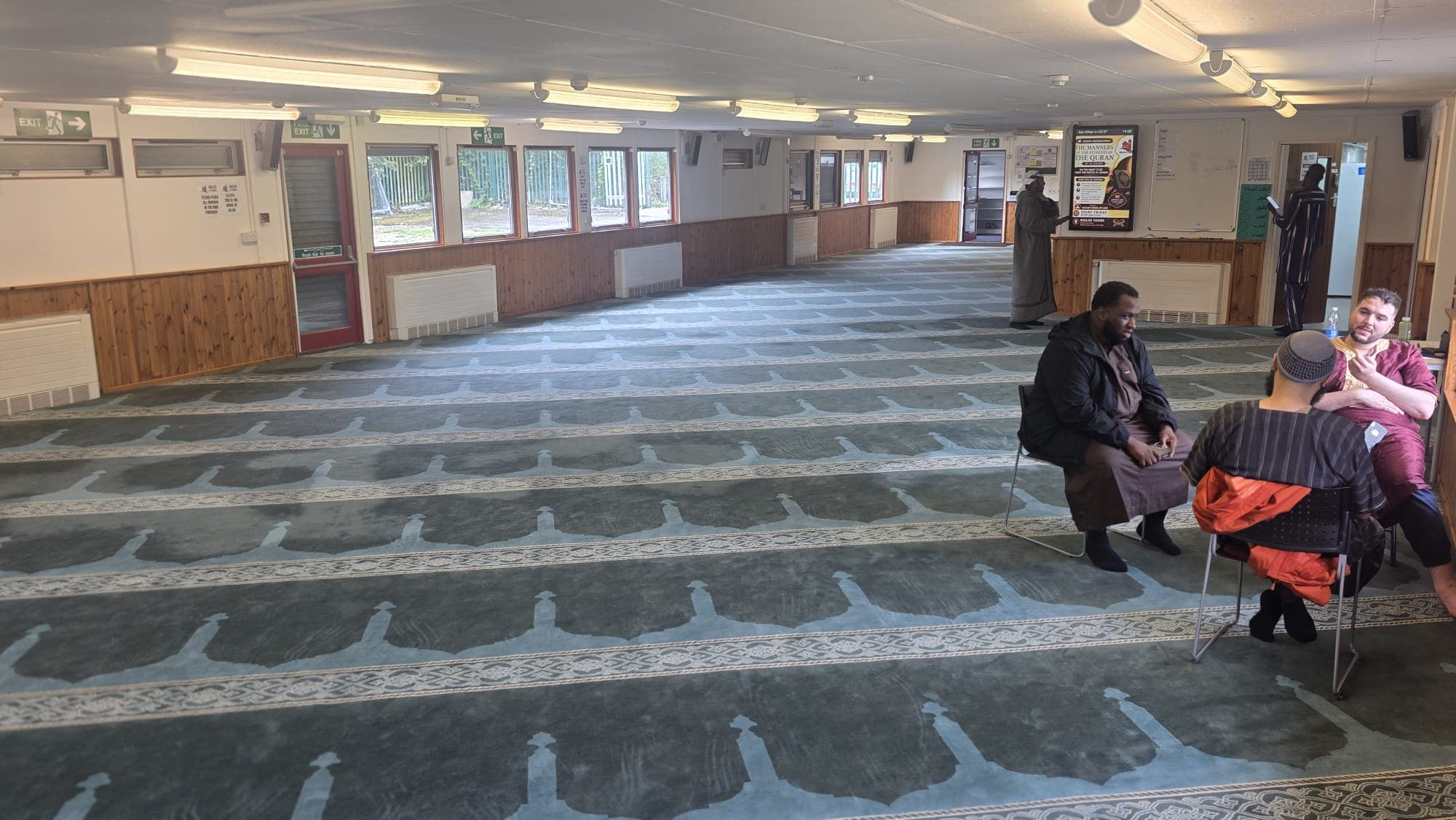 Community members gathering at Masjid At-Taqwa